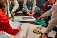 Members of the Children and Young People's Assembly on Biodiversity Loss discussing the impacts of climate change on biodiversity